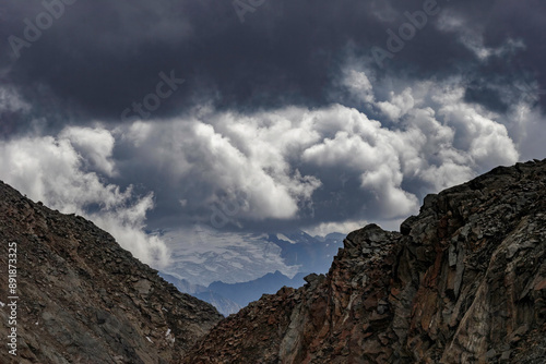 Layers of Austrian Alpine rocks and mountains stretch into the distance, showcasing the geological complexity of the region.