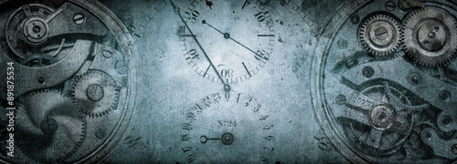 The dials of the old antique classic clocks on a vintage paper background. Concept of time, history, science, memory, information. Vintage clockwork background.