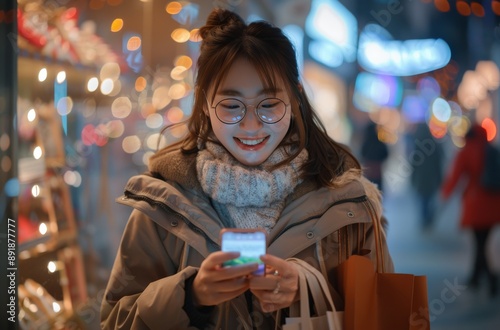 Woman Using Phone Under Christmas Lights