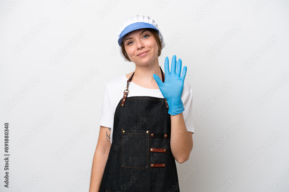 Fishmonger woman wearing an apron counting five with fingers Fishmonger woman wearing an apron counting five with fingers