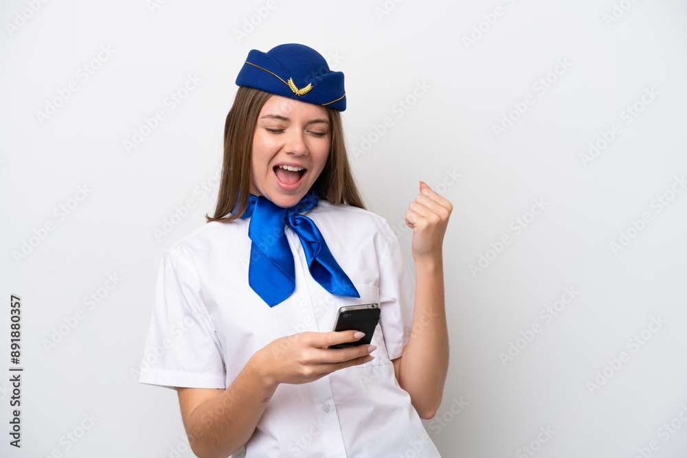 Airplane Lithuanian woman stewardess isolated on white background with phone in victory position Airplane Lithuanian woman stewardess isolated on white background with phone in victory position
