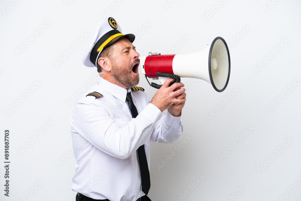 Airplane middle age pilot isolated on white background shouting through a megaphone Airplane middle age pilot isolated on white background shouting through a megaphone