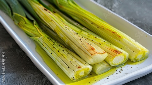 High-quality photo of Turkish leek with olive oil (Zeytinyagli Pirasa), served on a white plate photo