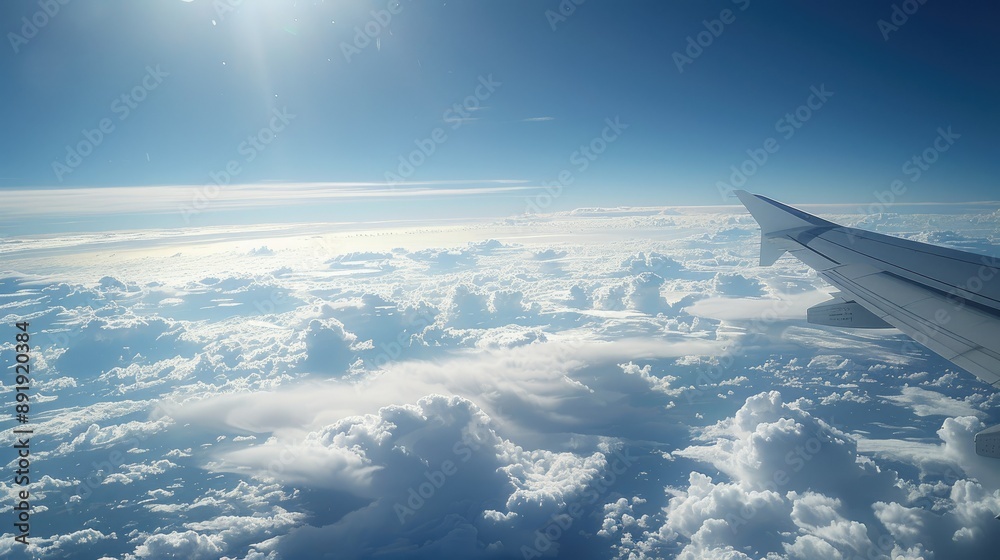 Plane window photo featuring wing, clouds, and Earth's curve in high-altitude space-like environment Plane window photo featuring wing, clouds, and Earth's curve in high-altitude space-like environment