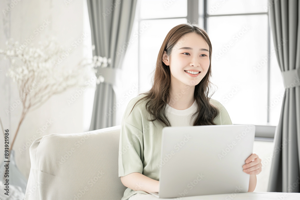 Cheerful Woman Working on Laptop - High-Quality Portrait Featuring Smiling Female in Cozy Home Setting, Remote Work, and Relaxed Atmosphere, Positive and Productive Moment Cheerful Woman Working on Laptop - High-Quality Portrait Featuring Smiling Female in Cozy Home Setting, Remote Work, and Relaxed Atmosphere, Positive and Productive Moment