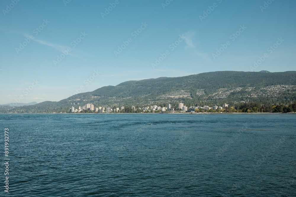 Scenic view of North Vancouver mountains over the water Scenic view of North Vancouver mountains over the water