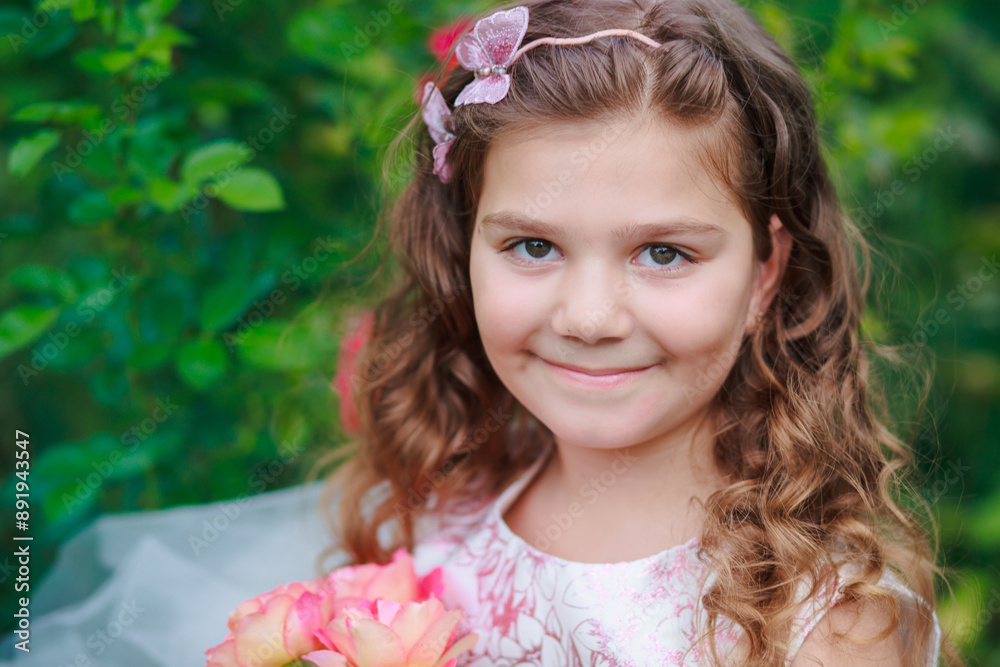 Girl with flowers in a garden