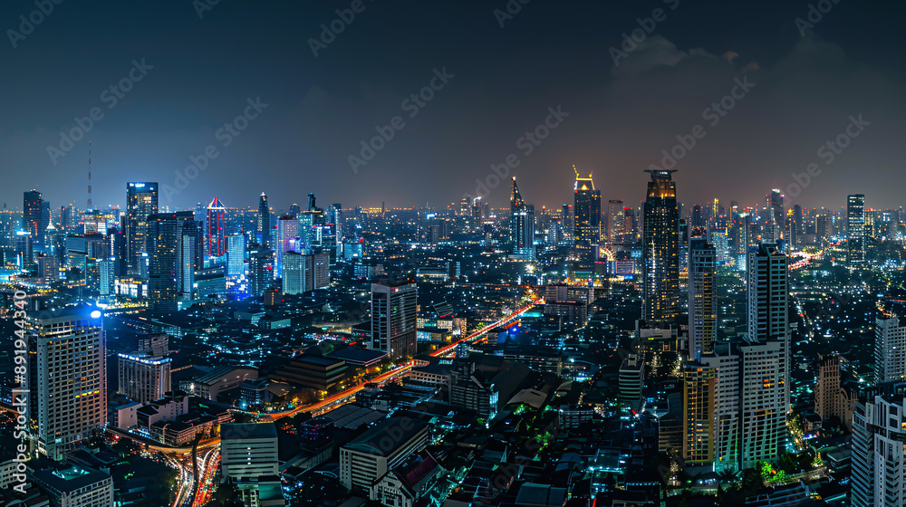 Fototapeta premium Panoramic view of Bangkok's bustling business district at night, illustrating the cityscape illuminated with lights and skyscrapers, portraying urban vibrancy and economic activity.