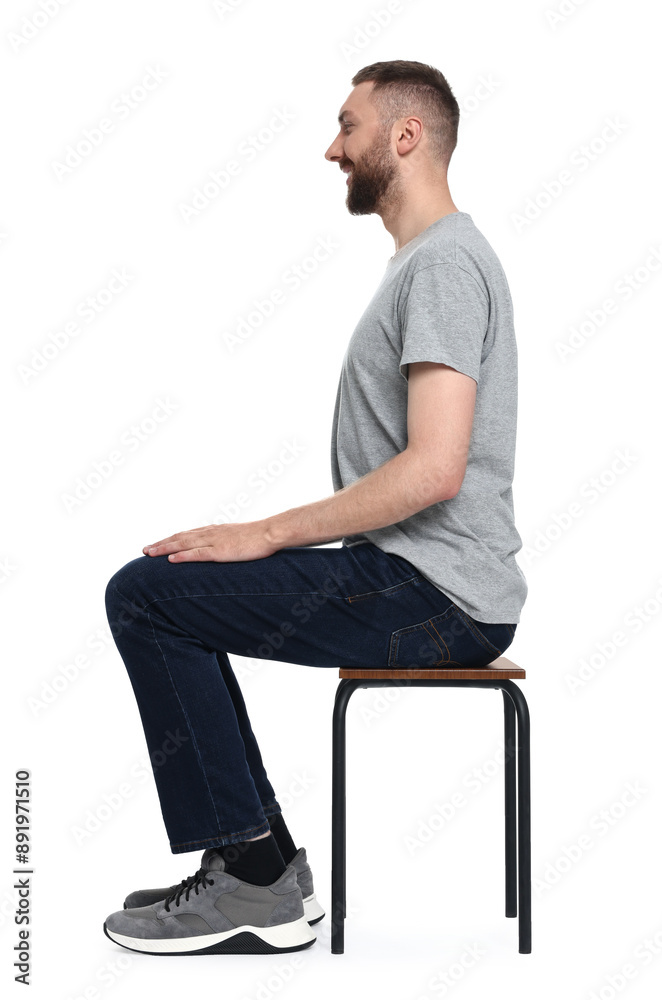 Man with good posture sitting on chair against white background Man with good posture sitting on chair against white background
