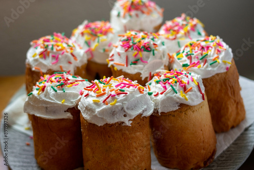 homemade easter cakes with icing and sprinkles on a plate 