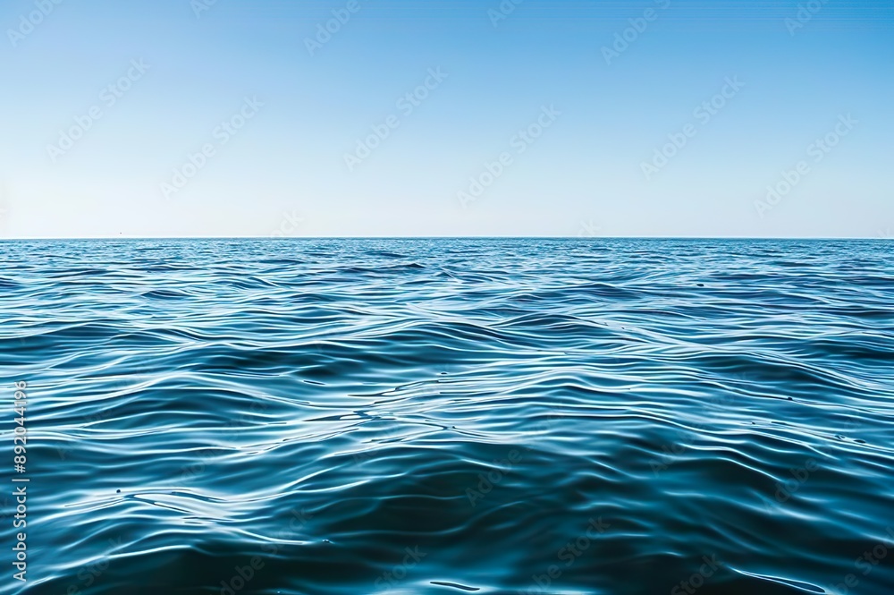 Fototapeta premium Calm Ocean Under Clear Blue Sky
