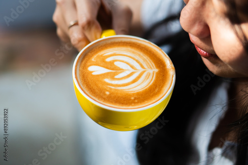 Close-up of Latte Art in Yellow Coffee Cup