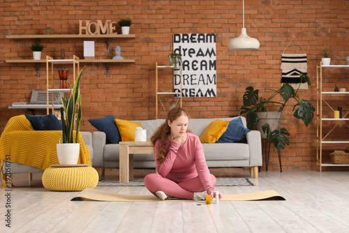 Sick young woman with sore ...