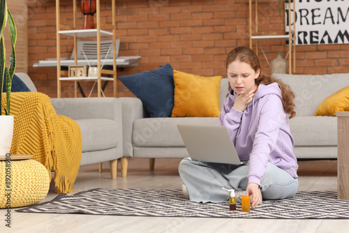 Sick young woman with sore ...