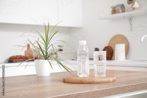 Bottle of water with glass ...