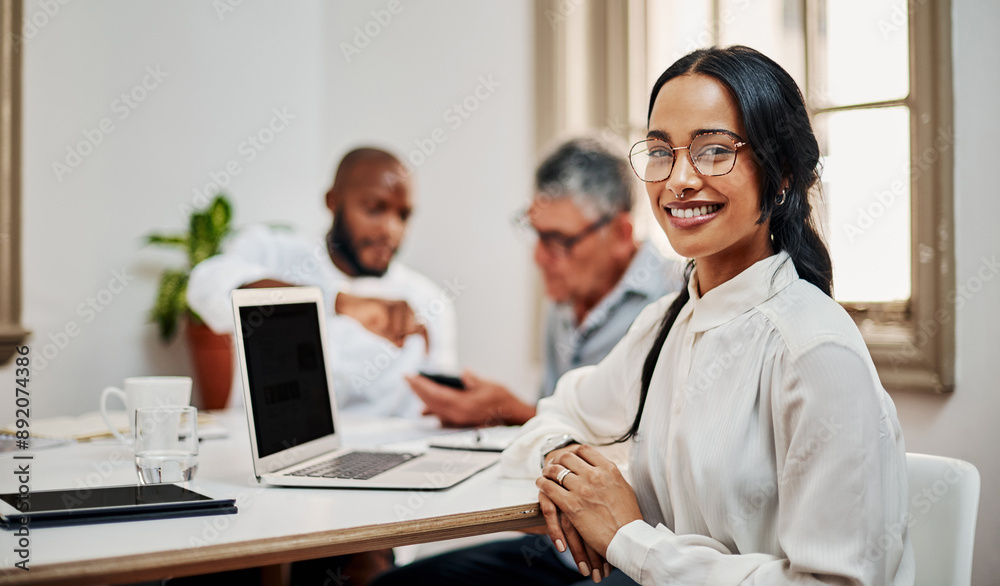 Obraz premium Portrait, business woman and laptop for teamwork with colleagues, mockup space or meeting in office. Female person, smile and tech as web designer, employee and professional for brief or presentation