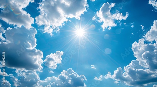 Fototapeta Naklejka Na Ścianę i Meble -  1. High-resolution image of a clear blue sky adorned with fluffy white clouds on a bright sunny summer day, capturing the serene beauty and vibrant colors of the season