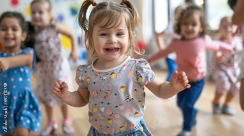 Children dancing happily together at nursery school