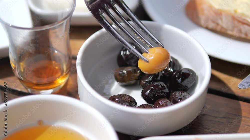 Collection of black and green olives with leaves. Collection of black and green olives with leaves.