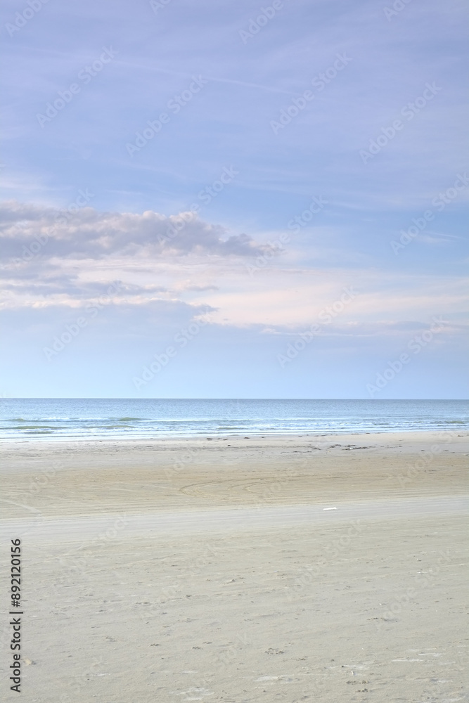 Horizon, sky and sand with landscape of beach for travel location, holiday and vacation in Denmark. Clouds, water or ocean with background of natural environment with sea shore for tropical adventure Horizon, sky and sand with landscape of beach for travel location, holiday and vacation in Denmark. Clouds, water or ocean with background of natural environment with sea shore for tropical adventure