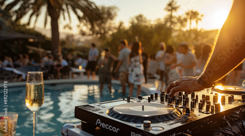 The concept of a summer pool party, with a close-up shot of a DJ playing music while people dance in the background, with a bokeh effect