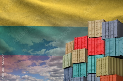 Lithuania flag and big stack of shipping cargo containers in docks with sky background close up photo