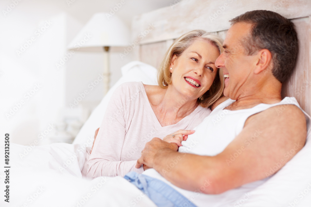 Mature couple, smile and holding hands in bed for relax, love and retirement together with trust and care. Man, woman and cuddle in home bedroom for marriage, loyalty or break on weekend with support Mature couple, smile and holding hands in bed for relax, love and retirement together with trust and care. Man, woman and cuddle in home bedroom for marriage, loyalty or break on weekend with support