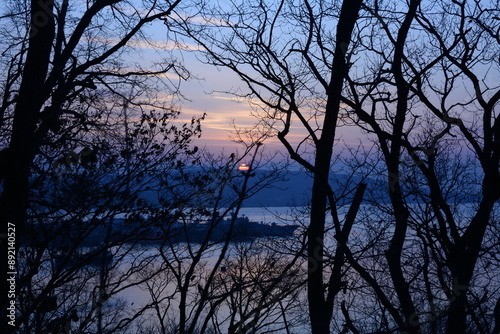 mystical sunset in a sea bay with ships
