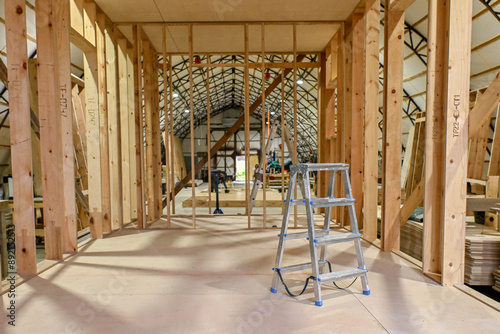 Wood wooden modular houses made of timber yellow board saw processing hands nail grind
