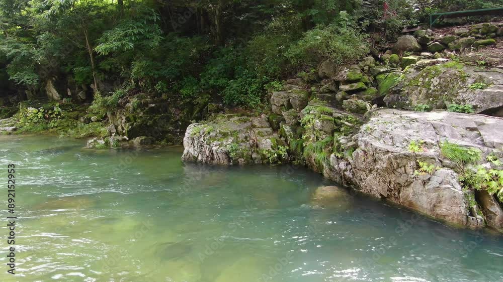 A valley where clear water flows to swim coolly in the hot summer, a high-definition video taken in 4k quality with a drone_3 A valley where clear water flows to swim coolly in the hot summer, a high-definition video taken in 4k quality with a drone_3