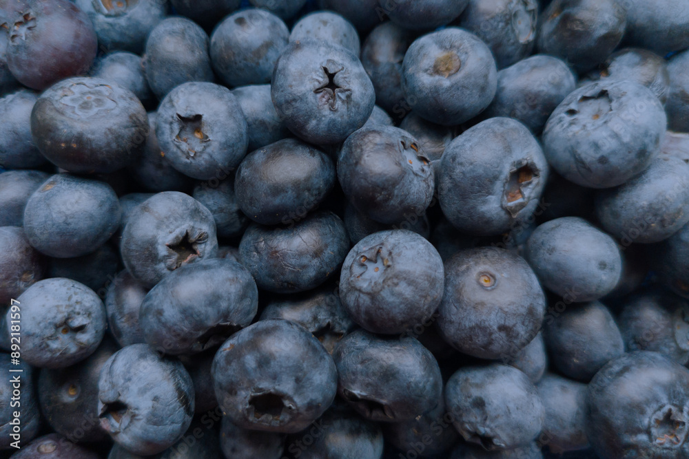 Many a lot of ripe juicy mature blueberries as superfood pattern.Healthy sweet food eating. Many a lot of ripe juicy mature blueberries as superfood pattern.Healthy sweet food eating.