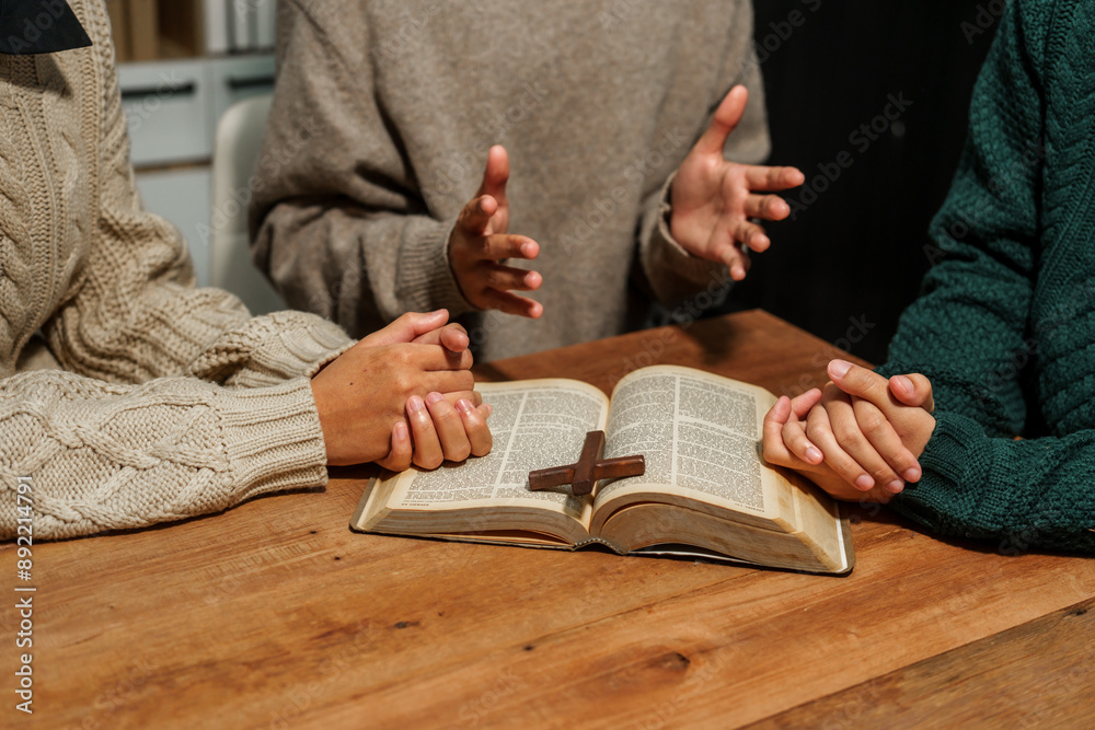 Fototapeta premium A person reads the Bible, embodying faith and spirituality. The scene reflects a serene moment of contemplation and devotion, highlighting the importance of religion in everyday life.
