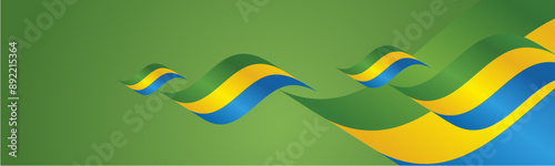 Gabon National Day waving flags two fold blue landscape background.ai photo