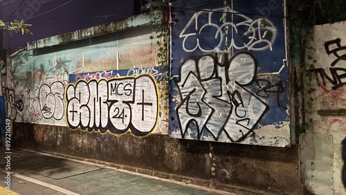 Walls covered in graffiti in the city of Jakarta