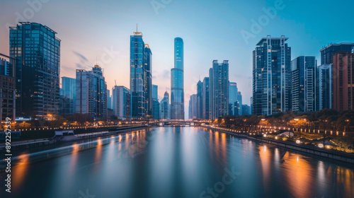 A modern cityscape with skyscrapers and a river running through the middle.