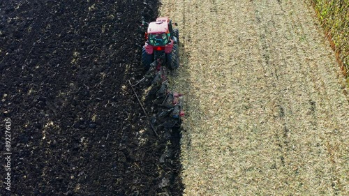 Aerial photo of agricultural machinery turning the black soil in Sanjiang Plain photo