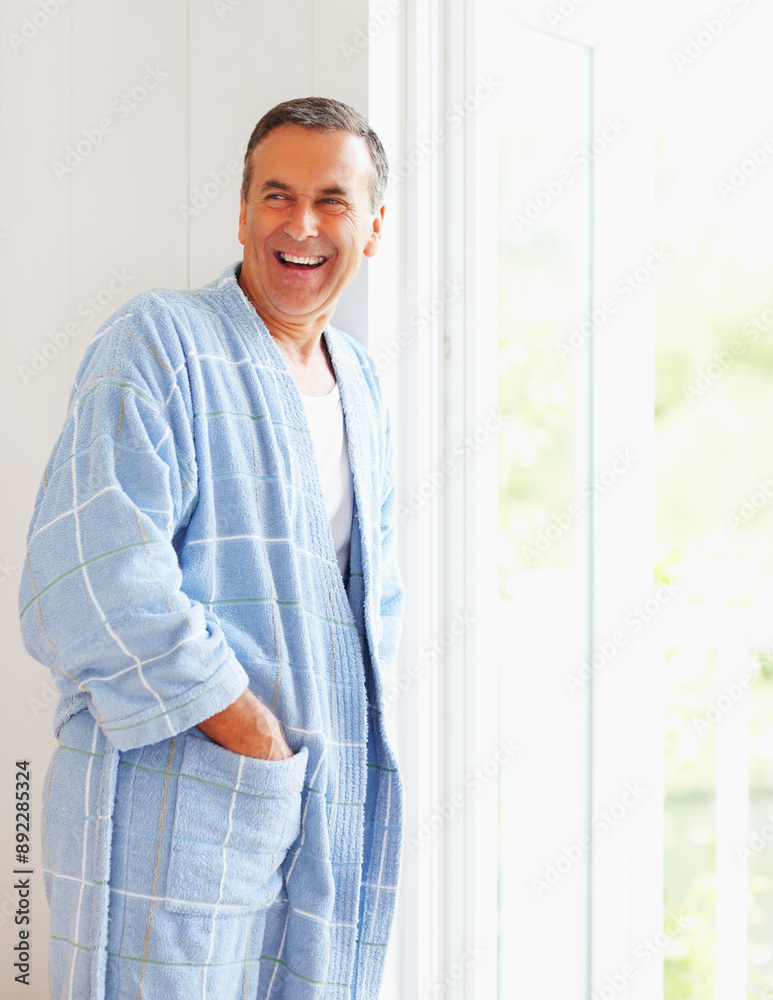 Senior man, happy and relax in home with mockup, retirement peace and mindfulness or wellness in weekend. Mature male person, smile and thinking with pyjamas, space and wake up for calm morning