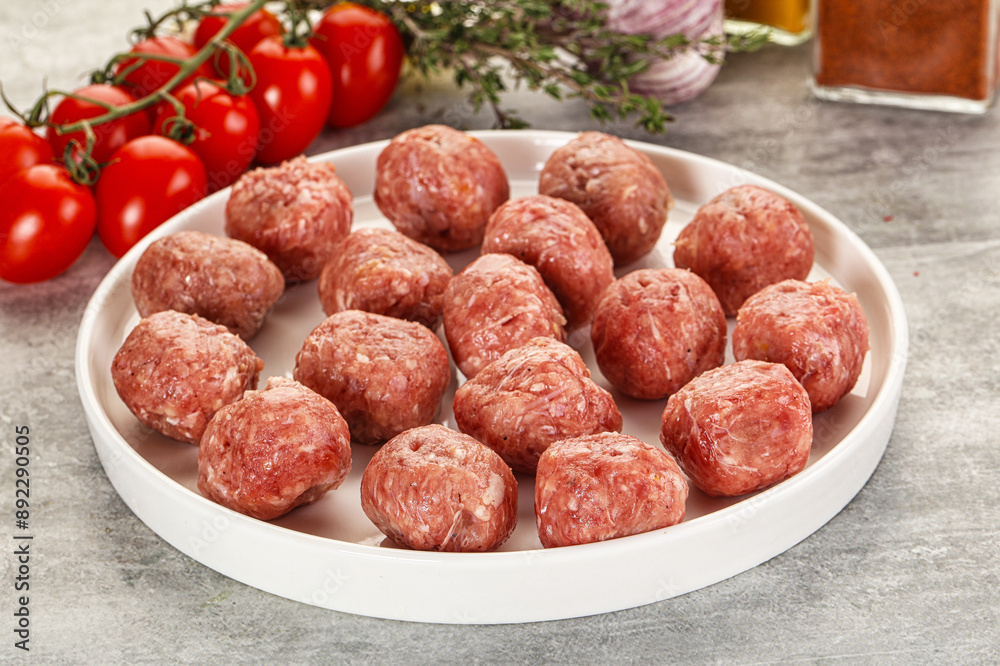 Uncooked raw beef meatball minced Uncooked raw beef meatball minced