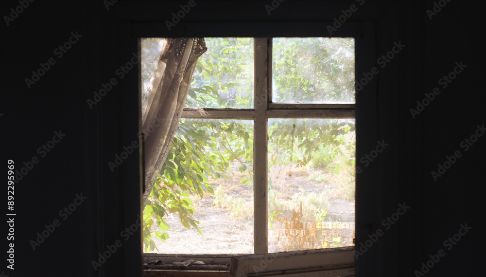 Sunlight on the window of an old abandoned house. Sunlight inside a dark house Sunlight on the window of an old abandoned house. Sunlight inside a dark house