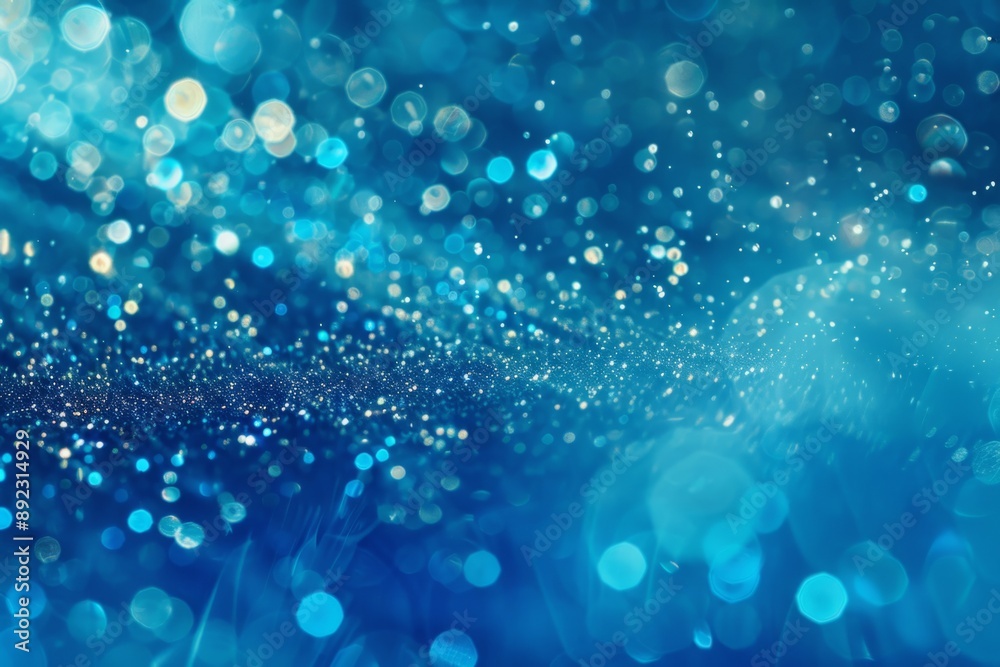A stunning abstract image with a blue background, filled with shimmering glitter and bokeh lights. It evokes concepts of sparkle, celebration, magic, and joy. A stunning abstract image with a blue background, filled with shimmering glitter and bokeh lights. It evokes concepts of sparkle, celebration, magic, and joy.