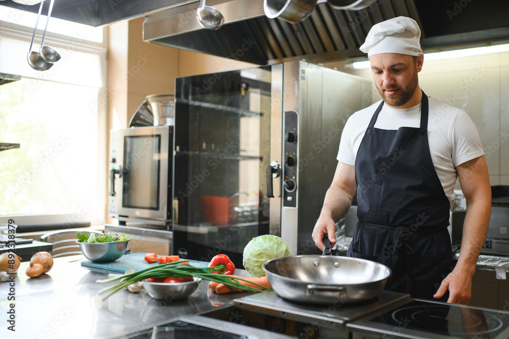 Chef cook preparing vegetables in his kitchen Chef cook preparing vegetables in his kitchen