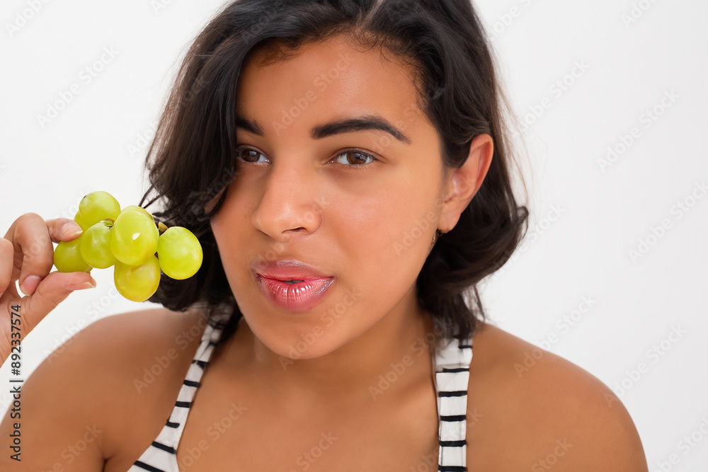 Girl eating grapes for healthy snack. cheese board fruit concept. a girl is eating a bunch of grapes. a girl eating a bunch of grapes lifestyle for health. Girl eating grapes for healthy snack. cheese board fruit concept. a girl is eating a bunch of grapes. a girl eating a bunch of grapes lifestyle for health.