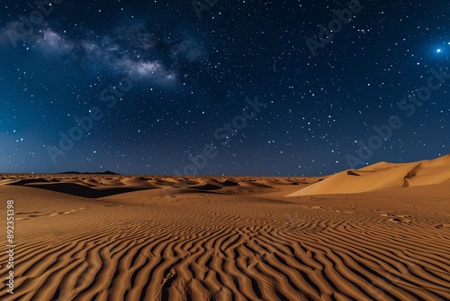 A vast desert landscape under a starry night sky. The sand dunes create a rippled pattern in the moonlight.