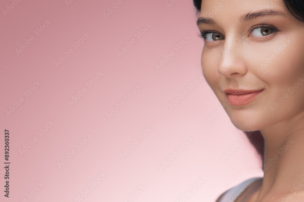 Elegant Asian Woman with Flawless Skin Smiling Against Pink Background Elegant Asian Woman with Flawless Skin Smiling Against Pink Background