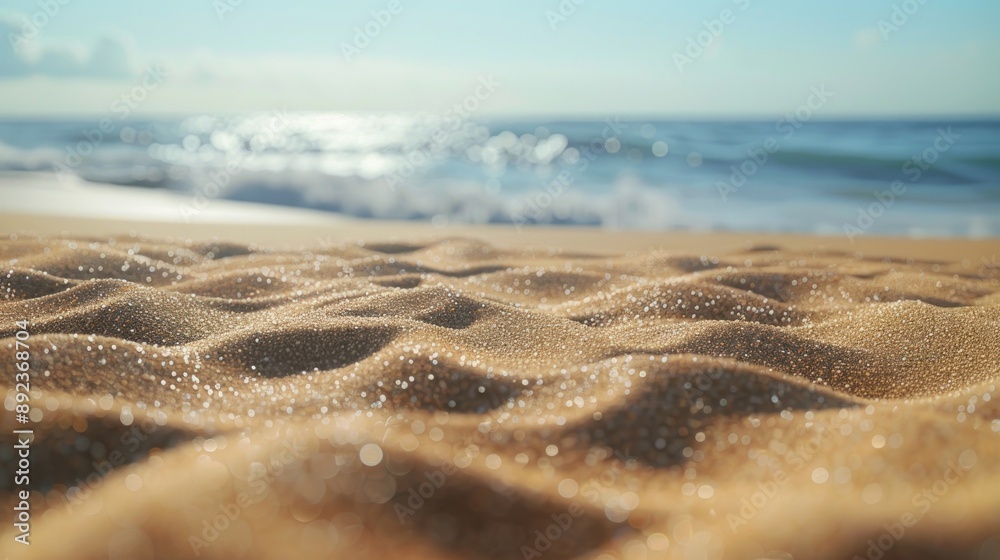 Close-up of Wet Sand on a Beach with Ocean Waves in the Background Close-up of Wet Sand on a Beach with Ocean Waves in the Background