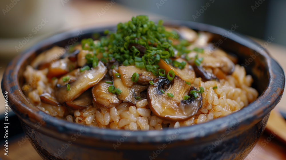 Close-up to a bowl of sizzling tasty rice with sliced mushrooms and greens in a rural bowl Close-up to a bowl of sizzling tasty rice with sliced mushrooms and greens in a rural bowl