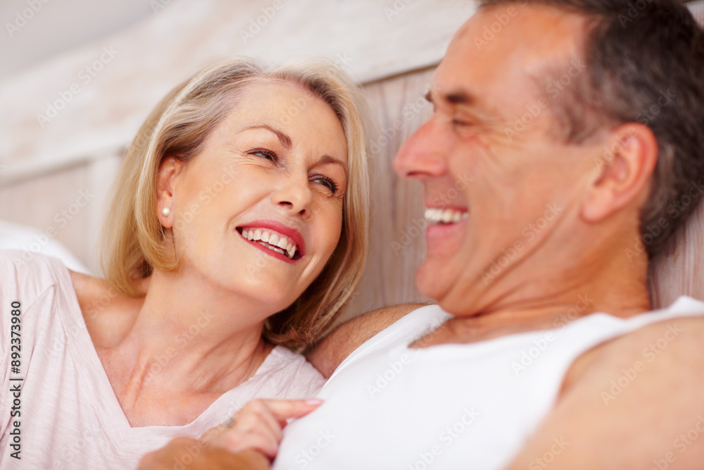 Mature couple, happy and romantic in bed at house for relax, love and retirement together with trust and care. Man, woman and flirt in bedroom for marriage, loyalty and playful on weekend with smile Mature couple, happy and romantic in bed at house for relax, love and retirement together with trust and care. Man, woman and flirt in bedroom for marriage, loyalty and playful on weekend with smile