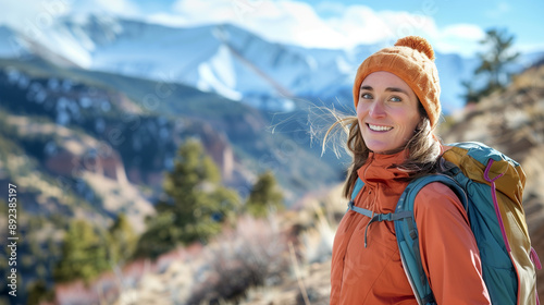 Happy woman on a scenic mountain hike