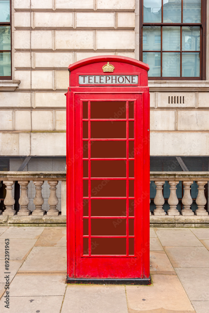 Red telephone box on Whitehall street in city of Westminster, London, UK Red telephone box on Whitehall street in city of Westminster, London, UK