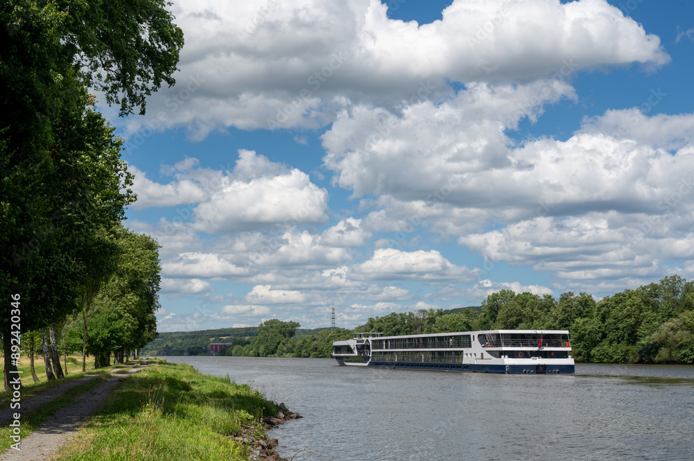 Fototapeta premium A boat on a river with nature and sky